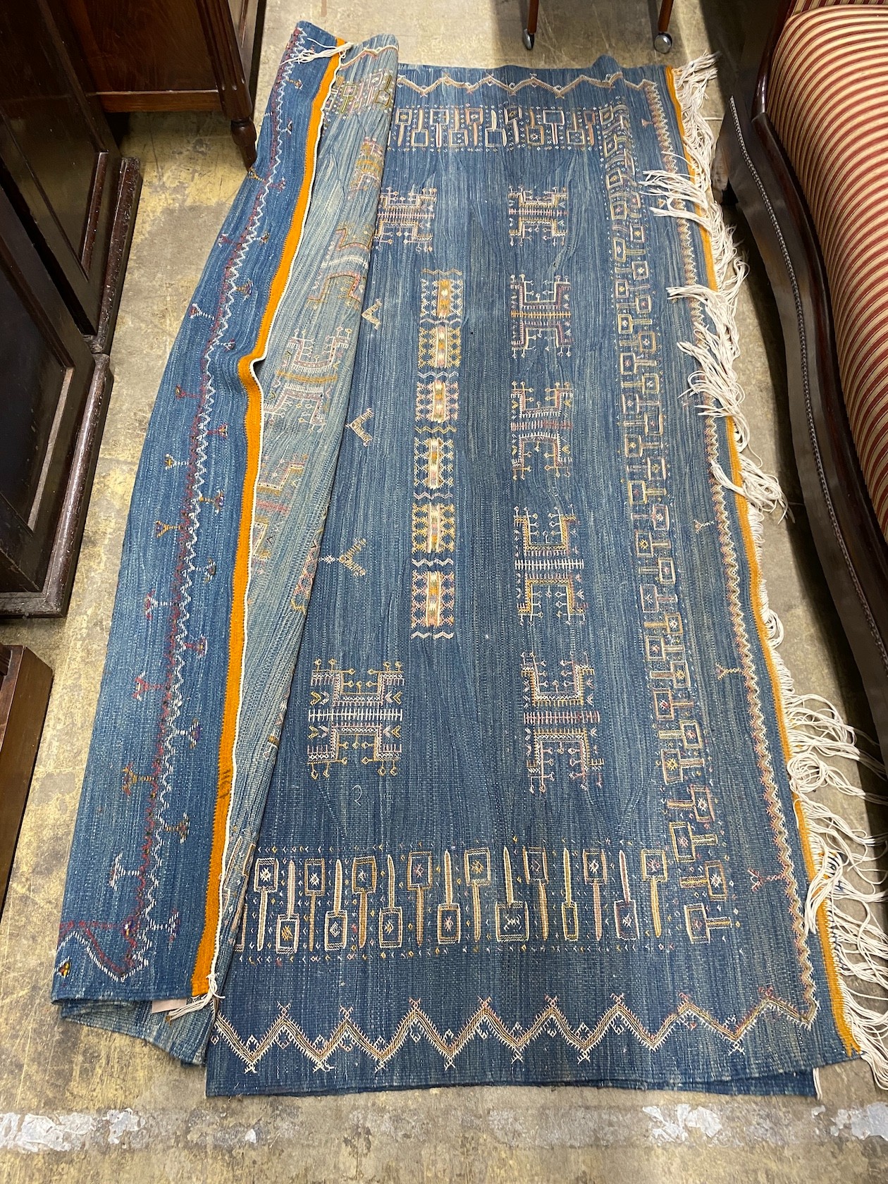 A Kilim polychrome carpet, approx. 320 x 200cm